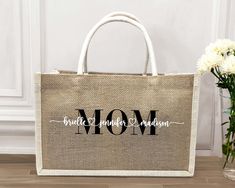 Mama with Childs Name Jute Tote Bag, Mom Tote Bag with Kids Name, Gift for Mother's Day, Mama Bag Gift, Mom To be Gift, Personalized Mom Bag Hi!  Welcome. It's great to see you here! ☺️ Personalized burlap totes are a great gift idea for moms who loves a rustic look. 🦋 Looking for personalized burlap tote bags? Look no further! Our custom bags are like works of art. Each one is crafted from high-quality burlap material and can be personalized with custom names or messages. 🦋 These elegant bags make the perfect gift. Their custom design sets them apart from other gifts and ensures they'll be remembered on special occasions. Plus, they're great for parties or beach trips. 🦋 Our burlap bags stand out not just for their style, but also for their durability. With spacious interiors, they mak Personalized Rectangular Bag For Mother's Day, Personalized White Bag For Mother's Day, Personalized White Bags For Mother's Day, White Rectangular Bags For Mother's Day, Beige Gift Bag For Mother's Day, Mother's Day Gift Bag In Beige, Beige Rectangular Bags For Mother's Day, Jute Tote Bag, Mom Bag