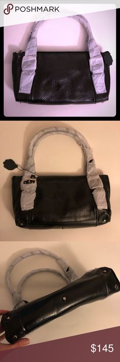 Nwot The Find Black Leather handbag jewel detail Nwot The Find Black Leather handbag jewel detail on handle buckles Mfr handle paper, gen leather tag, and inner stuffing intact, no price tag,  shopnbc featured brand Smaller but still Medium sized handbag, medium handles, more to carry lower arm/hand, would be under armpit if worn on shoulder  Tn7 The Find Bags Black Hobo Bag With Magnetic Closure Tote Shape, Black Hobo Bag With Magnetic Closure, Black Leather Hobo Bag With Magnetic Closure, Luxury Black Hobo Bag With Magnetic Closure, Black Rectangular Hobo Bag With Magnetic Closure, Black Hobo Bag With Magnetic Closure For Everyday Use, Black Leather Satchel With Magnetic Closure, Black Tote Satchel With Magnetic Closure, Black Leather Handbag