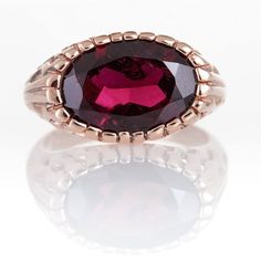 Coconut style Handmade Ring with Oval Garnet in 14K Rose Gold. Vintage style, statement ring that can match any outfit.► 14 Karat Rose Gold► Size 7.25► Total Weight 6.99 gr► Oval Garnet Stone 16x12All items are Handmade, I pay a lot of attention for every detail in the jewelry I design.All of my items are hand crafted in Kisufim's Designer jewelry Store in Tel Aviv, and shipped direct to customers all over the world. I am proud to say that many celebrities, models and stars across the world wear Elegant Faceted Ruby Ring For Formal Occasions, Elegant Formal Faceted Ruby Ring, Elegant Red Signet Ring For Formal Occasions, Elegant Red 14k Gold Signet Ring, Elegant Faceted Ruby Promise Ring, Elegant Ruby Signet Ring With Hallmark, Elegant Red Signet Ring For Wedding, Elegant Red Faceted Ring, Oval Rose Gold Hallmarked Ruby Ring