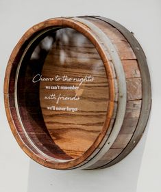 a wooden barrel with some writing on it