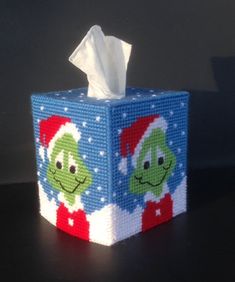 a christmas themed tissue box with two cartoon characters on it