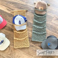 several hats are lined up on a wooden floor next to each other, including one with a hat hanging from it's side