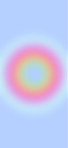 an abstract circular design in pink, blue and green on a light blue sky background