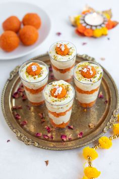 small desserts are arranged on a tray