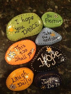 painted rocks with words on them that say, hope you dance