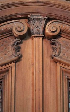 an ornate wooden door with decorative carvings on it