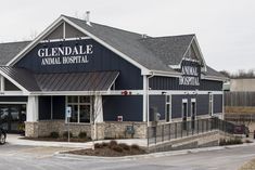 an animal hospital with a car parked in front