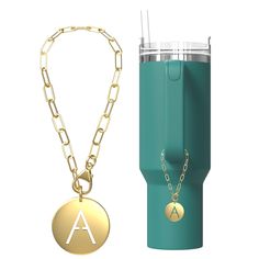 the initial charm is attached to a stainless steel travel mug with chain and keychain