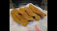 three fried food items sitting on top of a paper towel