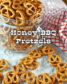 there is a bowl full of pretzels on top of a table with the words honey bbq pretzels above it