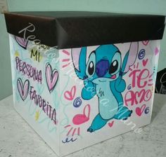 a box with an image of stitching and hearts on the inside is sitting on a table