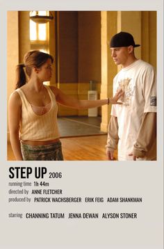 a man and woman standing next to each other in front of a poster with the words step up on it