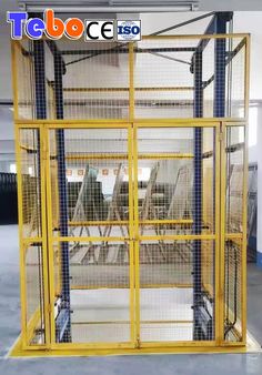 a large yellow cage in the middle of a room