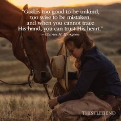 a woman kneeling down next to a horse with a quote about god's love