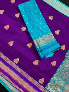 SILK MARK CERTIFIED !!! Stunning Pure Handloom Katan Silk Saree with Satin Patta Border in Eggplant Purple and Sky Blue Color. Border is 7 inches wide. The Butta on the saree is dense on the pallu side while its scattered on other end of the saree. Item : SareeBase Fabric : Pure Katan Silk Color : Purple and Sky Blue Blouse piece : Comes with un-stitched Blouse piece.Blouse material : Pure Katan Silk Fall & Edging(Yes/No) : YesSilk Mark Certificate given with the Saree(Yes/No) : Yes Disclaimer - Blue Zari Weaving Set For Puja, Blue Paithani Silk Saree Set, Blue Banarasi Silk Set For Puja, Blue Paithani Silk Sets For Puja, Festive Blue Paithani Silk Sets, Blue Salwar Kameez With Pallu For Puja, Blue Wedding Salwar Kameez With Zari Weaving, Katan Silk Saree, Men's Ethnic Wear