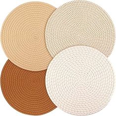 four round placemats in various colors