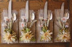 four forks and six spoons with flowers on them are lined up in a row