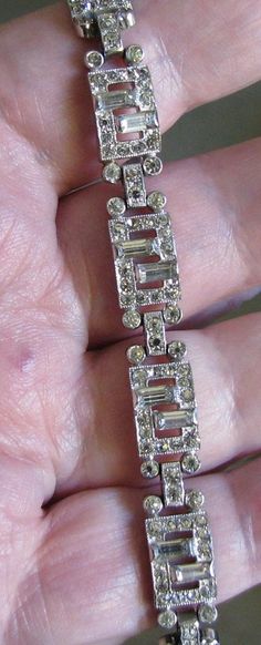 "Crown Trifari Art Deco style baguette and round rhinestone bracelet. This is in excellent, clean, undamaged condition. No missing, bad, or dull rhinestones. No noticeable wear or damage to silver tone frame. Measures 7\" x 3/8\"." Bracelet Art, Trifari Jewelry, Crown Trifari, Rhinestone Bracelet, Art Deco Style, Style Art, Deco Style, Soul Food, Chain Link Bracelet