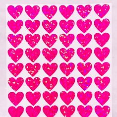 pink glitter hearts are arranged on a white background