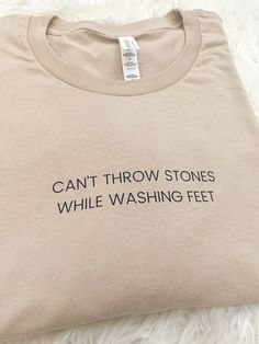 Can't Throw Stones While Washing Feet - Unisex T-shirt Can’t Throw Stones While Washing Feet Quote, Cotton Stretch T-shirt With Text Print, Stretch Crew Neck T-shirt With Text Print, Stretch Short Sleeve T-shirt With Text Print, Short Sleeve Stretch T-shirt With Text Print, Stretch Slogan T-shirt With Short Sleeves, Stretch Slogan T-shirt Short Sleeve, Stretch Graphic Tee With Letter Print, Stretch Graphic Tee With Crew Neck