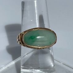 Crafted Of Yellow Gold And Jade, This Ring Seems To Be From The Edwardian Or Art Nouveau Period. It Has Vine-Like Scrolls And A Beautiful Bezel Set Cabochon. * 1 Piece Left Classic Jade Jewelry For Wedding, Classic Jade Wedding Jewelry, Fine Jewelry Green Oval Cabochon, Classic Jade Jewelry For May Birthstone, Antique Green Jewelry Stamped 14k, Antique Green 14k Stamped Jewelry, Antique Green Multi-stone Jewelry, Classic Cabochon Jewelry For May Birthstone, Fine Jewelry Jade With 17 Jewels