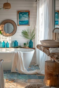 there is a bathtub and sink in this bathroom with blue accents on the walls