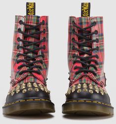 Decades of Docs lovers have been spicing up their boots and bags with added hardware. And now, that same DIY spirit is baked into our DNA. With this collection, we pay homage to alternative heritage and the fun of self-customization. The iconic 1460 boot keeps its classic silhouette, but adds a playful twist with stacked tartan, shiny studs, and edgy black accents. Of course, we couldn't leave out our signature markings. These boots are made with our signature air-cushioned sole and welted const Painted Doc Martens, Fred Perry Amy Winehouse, Matt Murdock, Fred Perry Shirt, Dr Martens Shoes, Boots Uk, Leather Lace Up Boots, Studded Leather, Unique Shoes