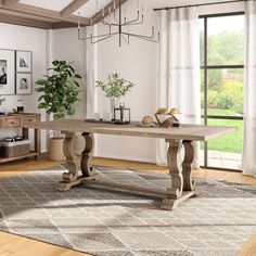 a large wooden table sitting on top of a rug