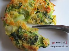 broccoli and cheese quiche on a white plate with a fork next to it