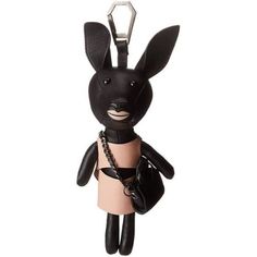 a key chain with a black bunny holding a purse