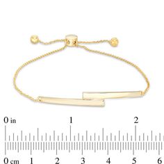 So chic and modern, this bar bolo bracelet complements any attire. Crafted in 10K gold, this on-trend look showcases two tapered bars bypassing at the center. Polished to a bright shine, this cable chain bracelet adjusts up to 9.5 inches in length and secures with a bolo clasp and ball ends. Sleek Adjustable Jewelry With Polished Finish, Sleek Adjustable Gold Jewelry, Adjustable Rectangular Gold Bracelet For Formal Occasions, Modern Adjustable 14k Gold Bracelet, Adjustable Rectangular Gold Bracelet, Modern Gold Jewelry With Sliding Knot, Modern Yellow Gold Adjustable Jewelry, Bolo Bracelet, Peoples Jewellers