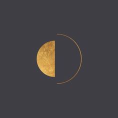 the moon is shown in gold on a black background