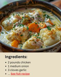 a bowl filled with chicken and dumplings on top of a wooden table