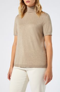 Enjoy the warmth and sophistication of this short-sleeve turtleneck sweater elevated in a luxe cashmere-kissed blend. Turtleneck Short sleeves 65% viscose, 32% polyamide, 3% cashmere Hand wash, dry flat Imported Classic Turtleneck Knit Top, Cashmere Turtleneck Top With Relaxed Fit, Relaxed Fit Turtleneck Cashmere Top, Relaxed Fit Cashmere Turtleneck Top, Classic Knit Top With Funnel Neck, Chic Short Sleeve Fine Knit Sweater, Classic Knit Funnel Neck Top, Elegant Fine Knit Short Sleeve T-shirt, Short Sleeve Fine Knit Cashmere Top