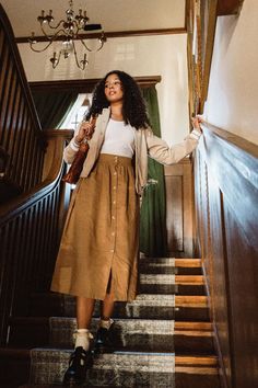 The perfect skirt for fall/winter layering! #backtoschool #casualpreppy #falloutfits #fall #dresstoimpress Skirt With Buttons In Front Outfit, Long Tan Skirt Outfit, Fall Layered Outfits, Long Tan Skirt, Tan Skirt Outfits, Fall Layering Outfits, Teacher Styles, Quirky Outfits, Layering Outfits Fall