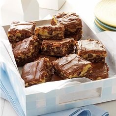 a box filled with brownies sitting on top of a table