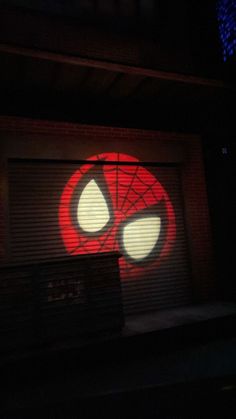 a garage door with the word deadpool projected on it