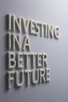 the words investing in a better future are made out of white letters on a gray background