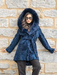 This astrakhan furry coat, in a dark blue color is truly one of a kind! A hard to find, unique piece ,is like nothing you've ever had as an outerwear! In a long, comfortable line ,with a fluffy fox hood, embossed patterns, this piece will be the reason you want to stroll around on the cold winter days and nights! For dreamy, classy and sophisticated looks, this coat of incomparable quality , is a must have! Astrakhan fur coat with eye hook closures Front closure Concealed side pockets Long sleev Blue Fur Coat, Winter Fur Coats, Melbourne Fashion, Australia Fashion, Coat With Belt, Real Fur Coat, Luxury Gifts For Her, Coat Winter, Dark Blue Color