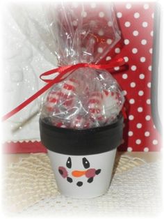 a cup filled with candy and wrapped in plastic