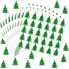 green christmas trees are arranged on white paper