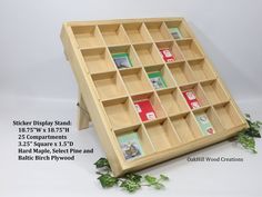 a wooden display case filled with lots of compartments