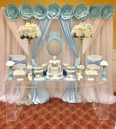 a baby shower party with blue and white decorations