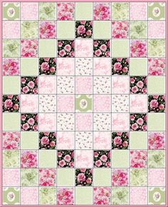 a pink and green quilt with flowers on it