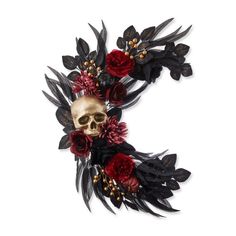 a skull with flowers and leaves on it's head is shown in the shape of a crescent