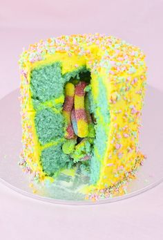 there is a cake that looks like it has been cut in half with sprinkles