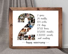 a wooden frame with the number two on it and photos in different frames that say happy anniversary