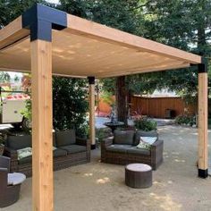 an outdoor living area with couches, chairs and a pergolated gazebo