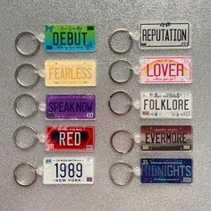 several license plates are arranged on a silver surface, including one for the new york state