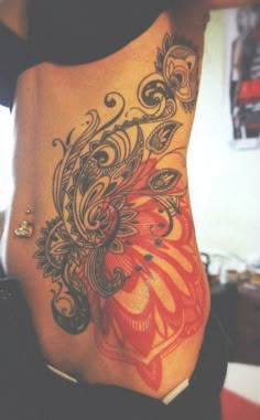 a woman's stomach with an artistic design on it